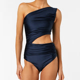 Navy blue one-shoulder swimsuit with cutout design on a white background.