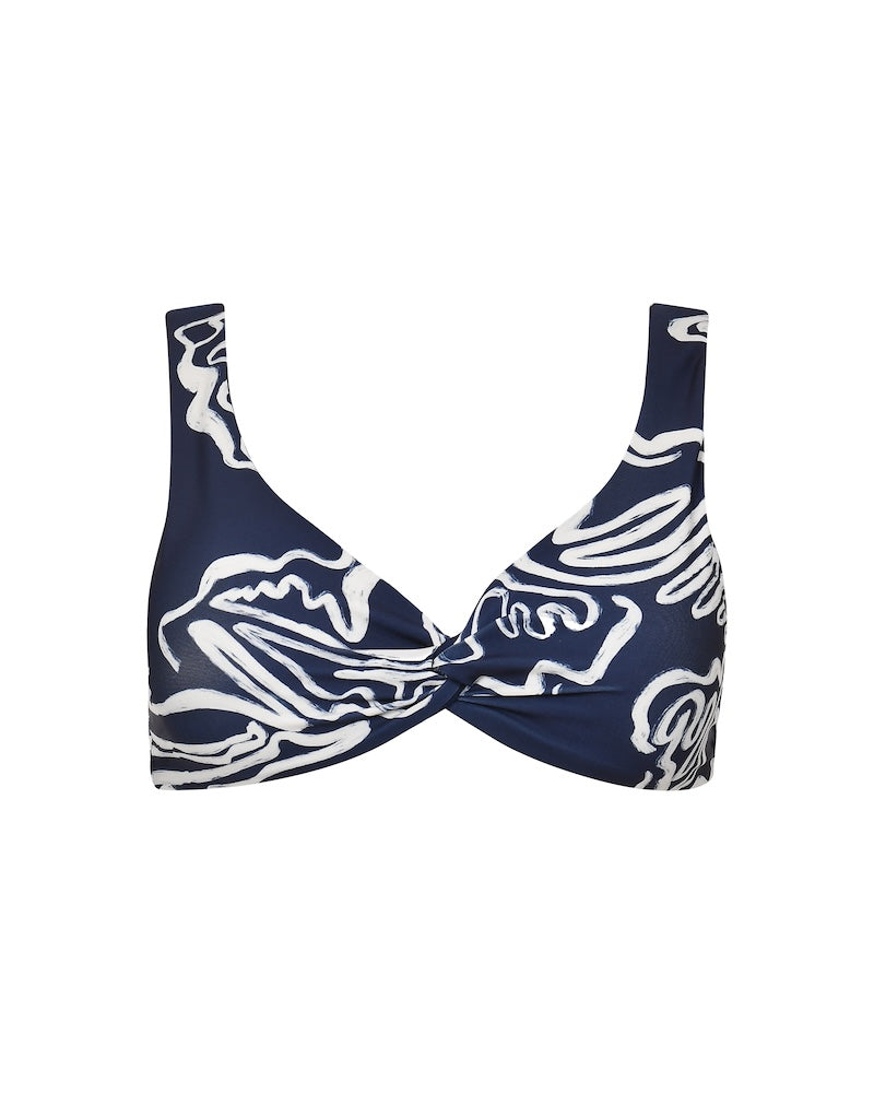 Navy blue bikini top with white abstract patterns on a white background.