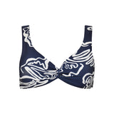 Navy blue bikini top with white abstract patterns on a white background.