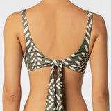 Green and white patterned bikini top on a plain background.