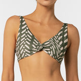 Green and white patterned bikini top on a plain background.