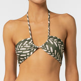 Green and white patterned bikini top on a plain background.