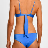 Blue bikini with thin braided straps on a white background.