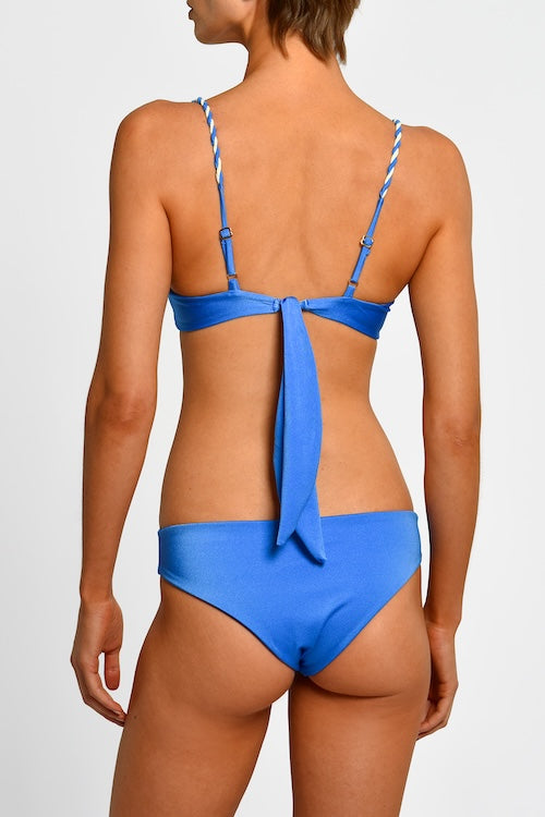 Blue bikini with thin braided straps on a white background.