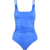 Blue one-piece swimsuit with thin braided straps on a white background.
