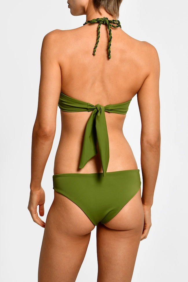 Green halter style bikini with a tie-back design on a white background.