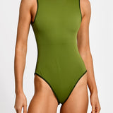 Green one-piece swimsuit worn by a model on a white background.