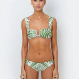 A model wearing a green palm leaf print bikini with full-coverage design bottoms.