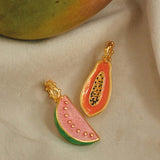 A close-up of gold plated papaya and watermelon charms.