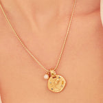 A 24k gold-plated necklace for Aquarius  zodiac pendant, accompanied by a natural stone charm.