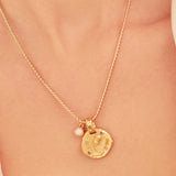 A 24k gold-plated necklace for Aquarius  zodiac pendant, accompanied by a natural stone charm.
