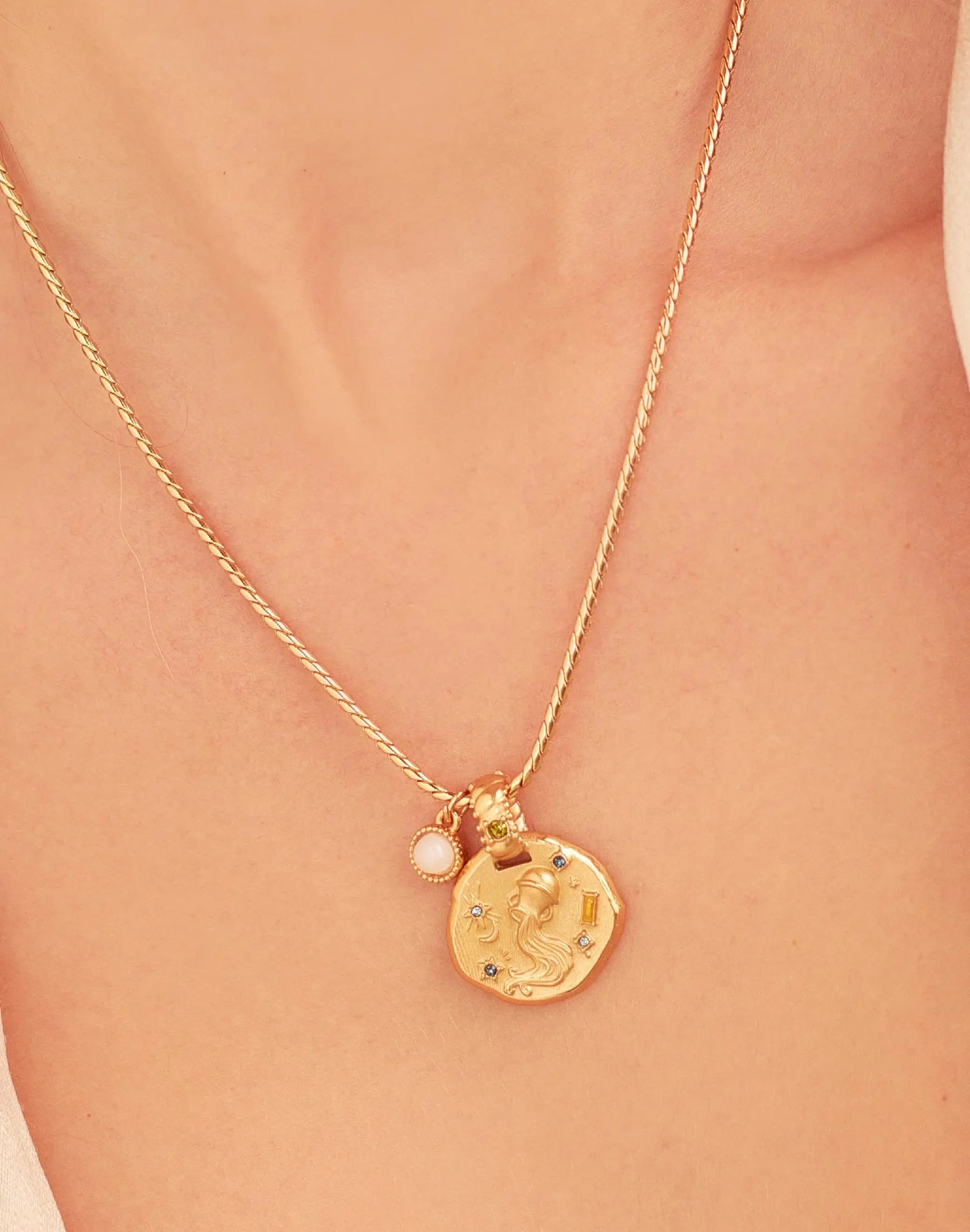 A 24k gold-plated necklace for Aquarius  zodiac pendant, accompanied by a natural stone charm.