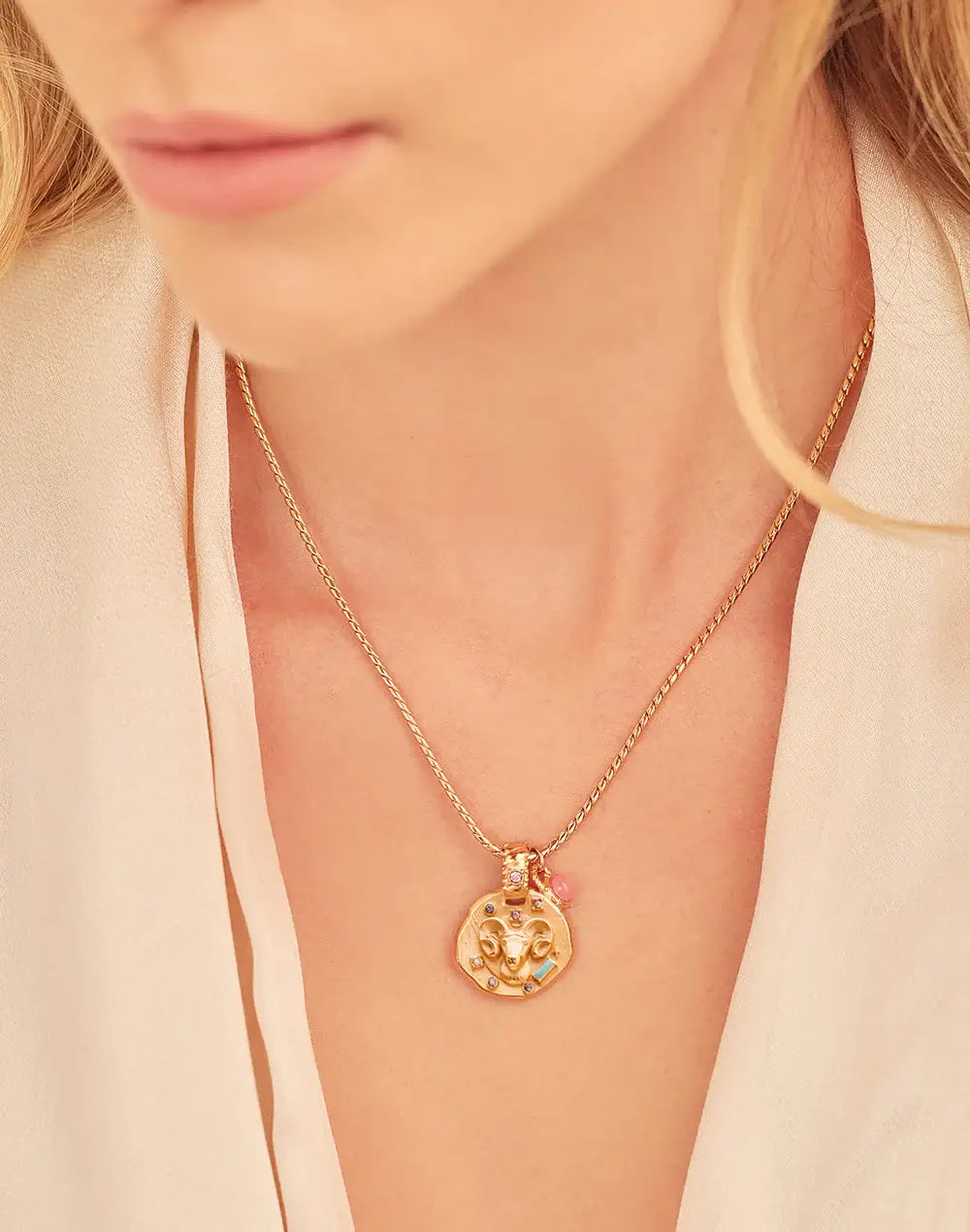 A 24k gold-plated necklace for Aries  zodiac pendant, accompanied by a natural stone charm.