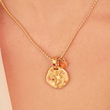 A 24k gold-plated necklace for Capricorn  zodiac pendant, accompanied by a natural stone charm.