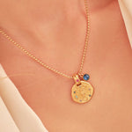 A 24k gold-plated necklace for Scorpio zodiac pendant, accompanied by a natural stone charm.