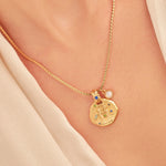 A 24k gold-plated necklace for Gemini  zodiac pendant, accompanied by a natural stone charm.
