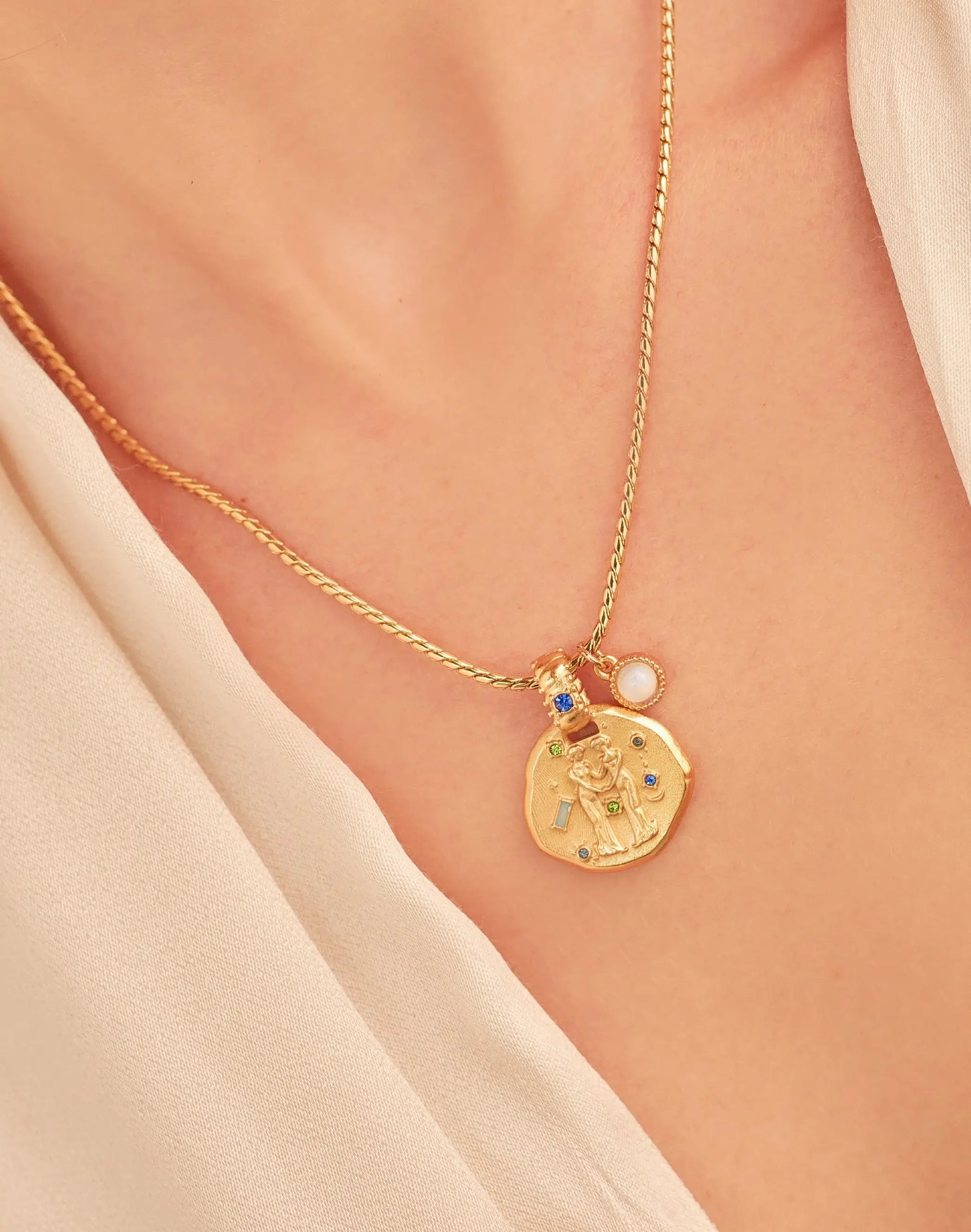 A 24k gold-plated necklace for Gemini  zodiac pendant, accompanied by a natural stone charm.