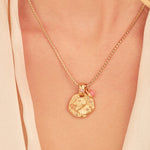 A 24k gold-plated necklace for Leo zodiac pendant, accompanied by a natural stone charm.