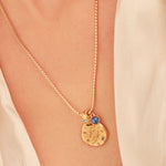 A 24k gold-plated necklace for Pisces  zodiac pendant, accompanied by a natural stone charm.