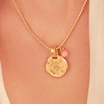 A 24k gold-plated necklace for Sagittarius  zodiac pendant, accompanied by a natural stone charm.