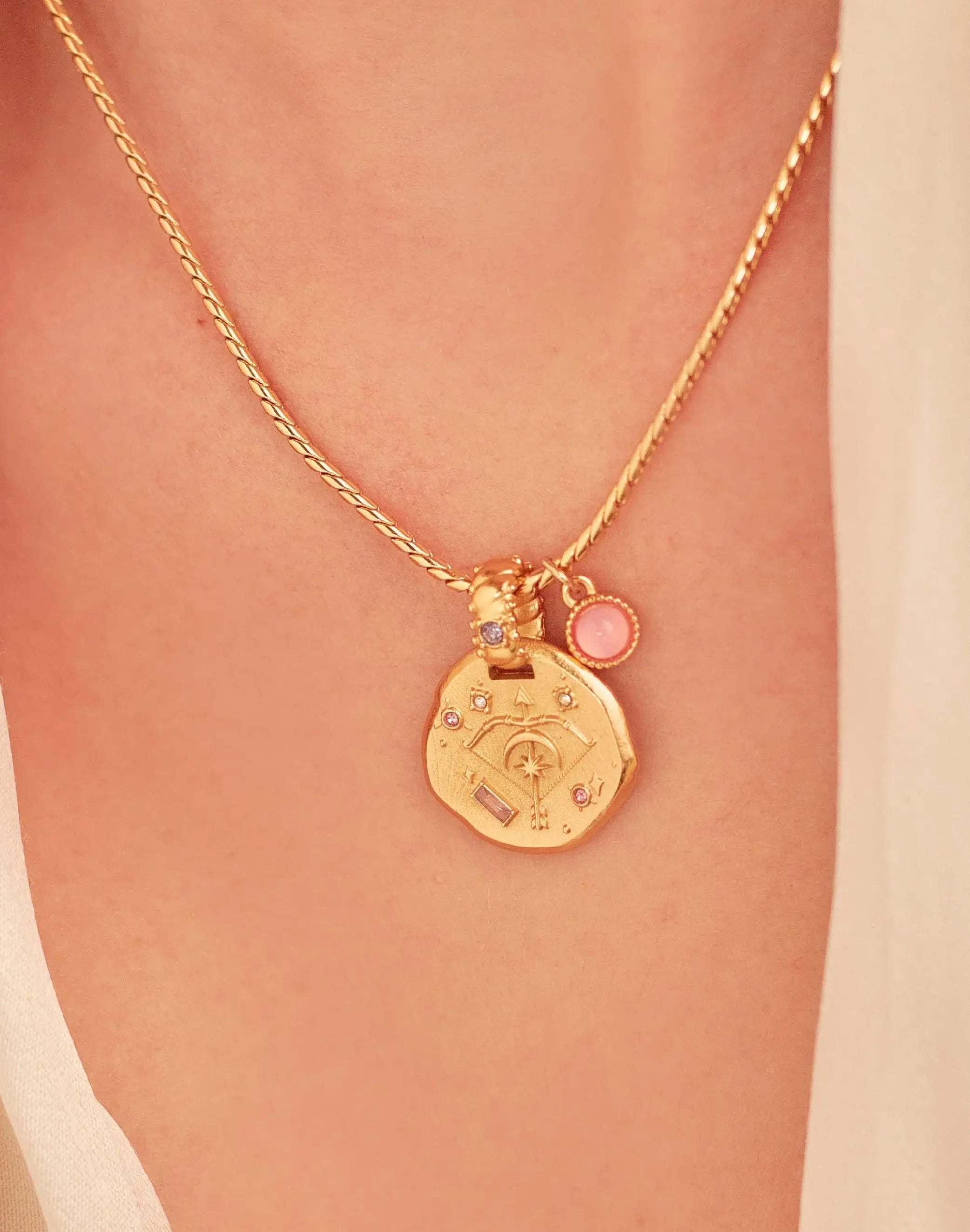 A 24k gold-plated necklace for Sagittarius  zodiac pendant, accompanied by a natural stone charm.