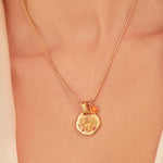 A 24k gold-plated necklace for Tauro  zodiac pendant, accompanied by a natural stone charm.