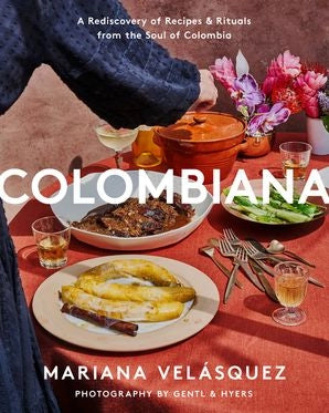 The cover of the cookbook 'Colombiana' by Mariana Velászquez features a colorful display of traditional Colombian dishes and a warm, inviting atmosphere.