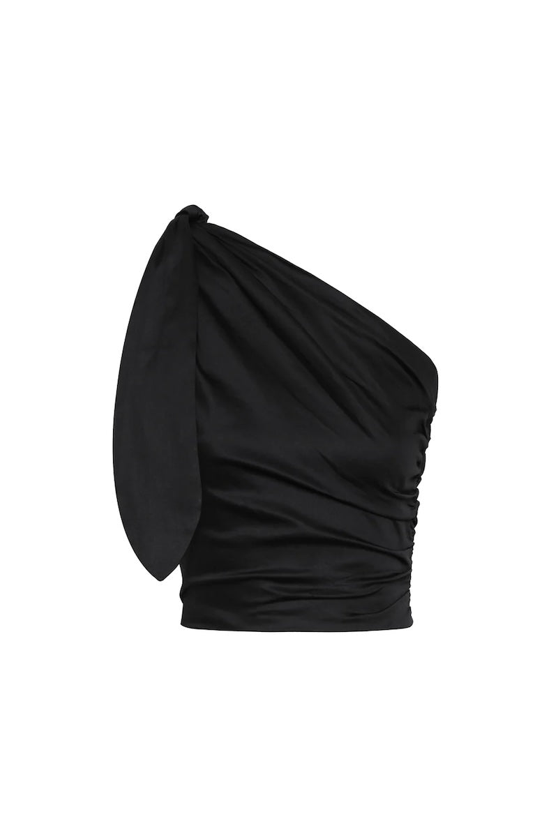 Image of a one shoulder top in black. The image is set against a white background. The purpose of this image is to highlight the clothing by Encantadore because it's for sale at EVAMAIA boutique in Studio City, CA.