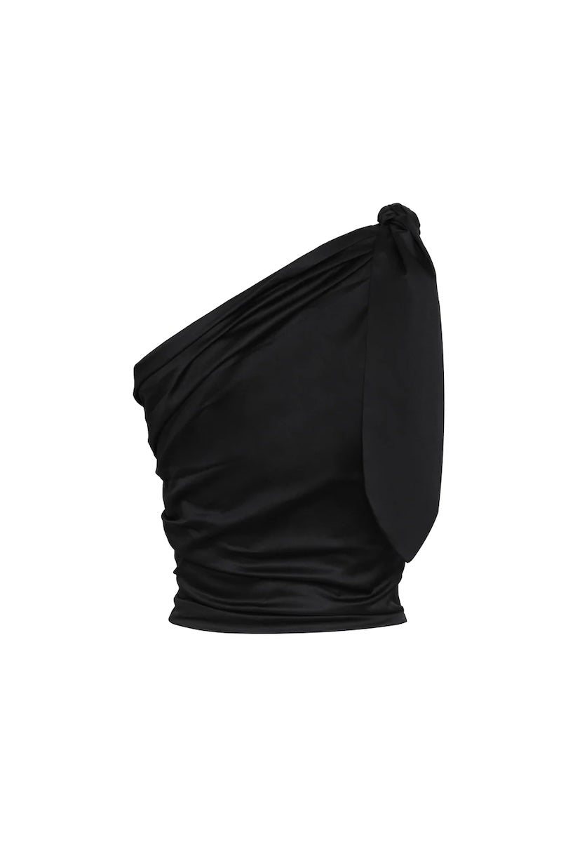 Image of the back of a one shoulder top in black. The image is set against a white background. The purpose of this image is to highlight the clothing by Encantadore because it's for sale at EVAMAIA boutique in Studio City, CA.