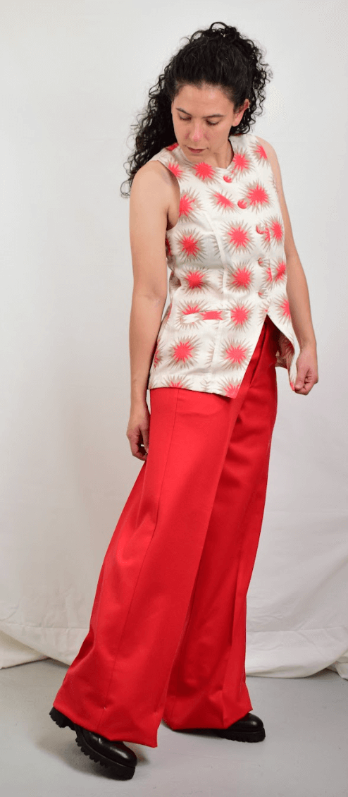 Model wearing red wool pants and blouse