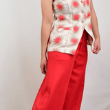 Model wearing red wool pants and blouse