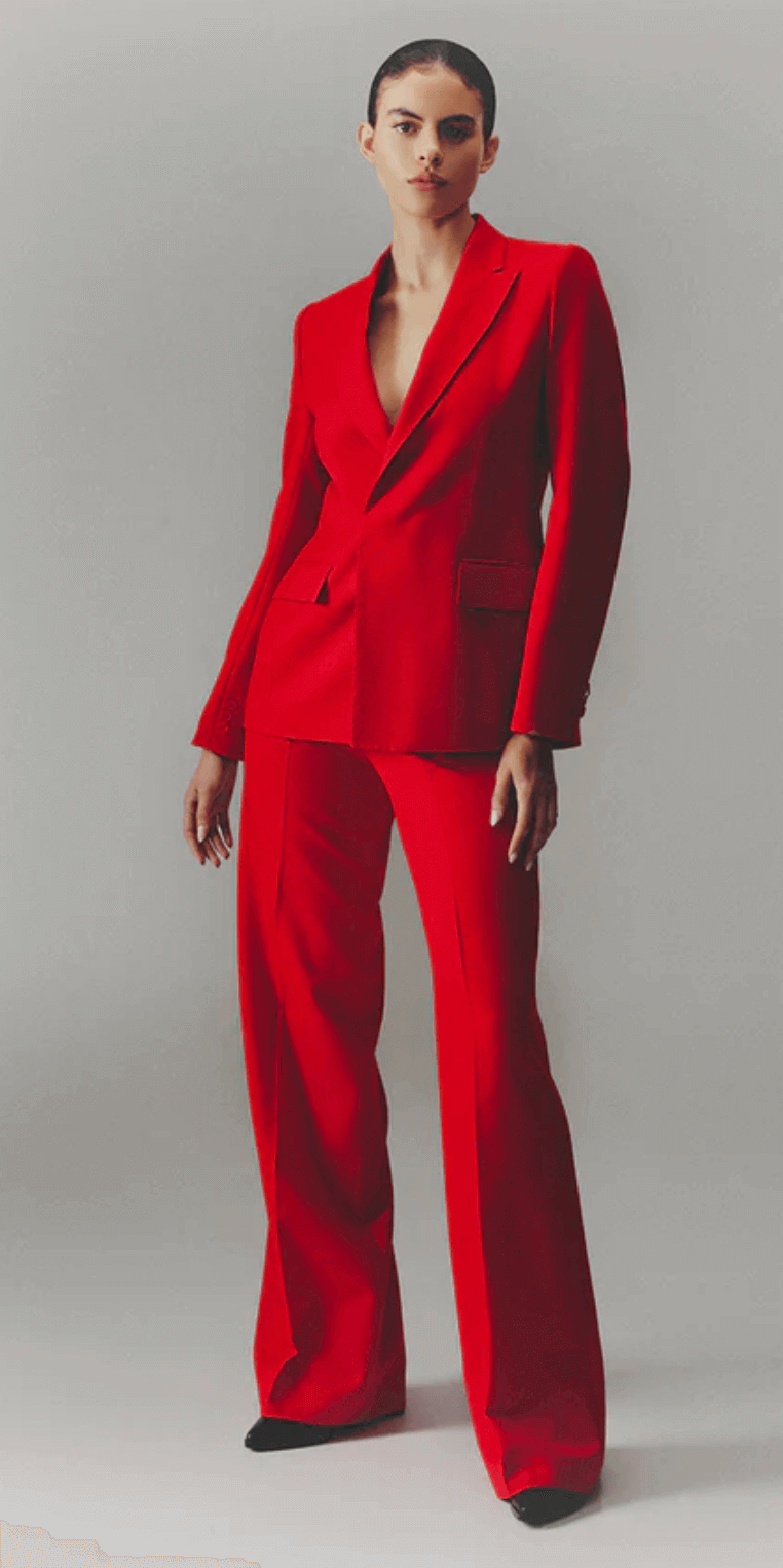 Model wearing red wool pants and blazer