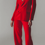 Model wearing red wool pants and blazer