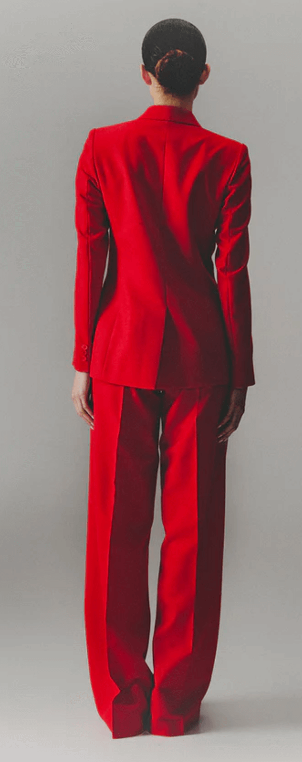 Model wearing red wool pants and blazer