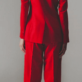 Model wearing red wool pants and blazer