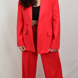 Model wearing red wool pants