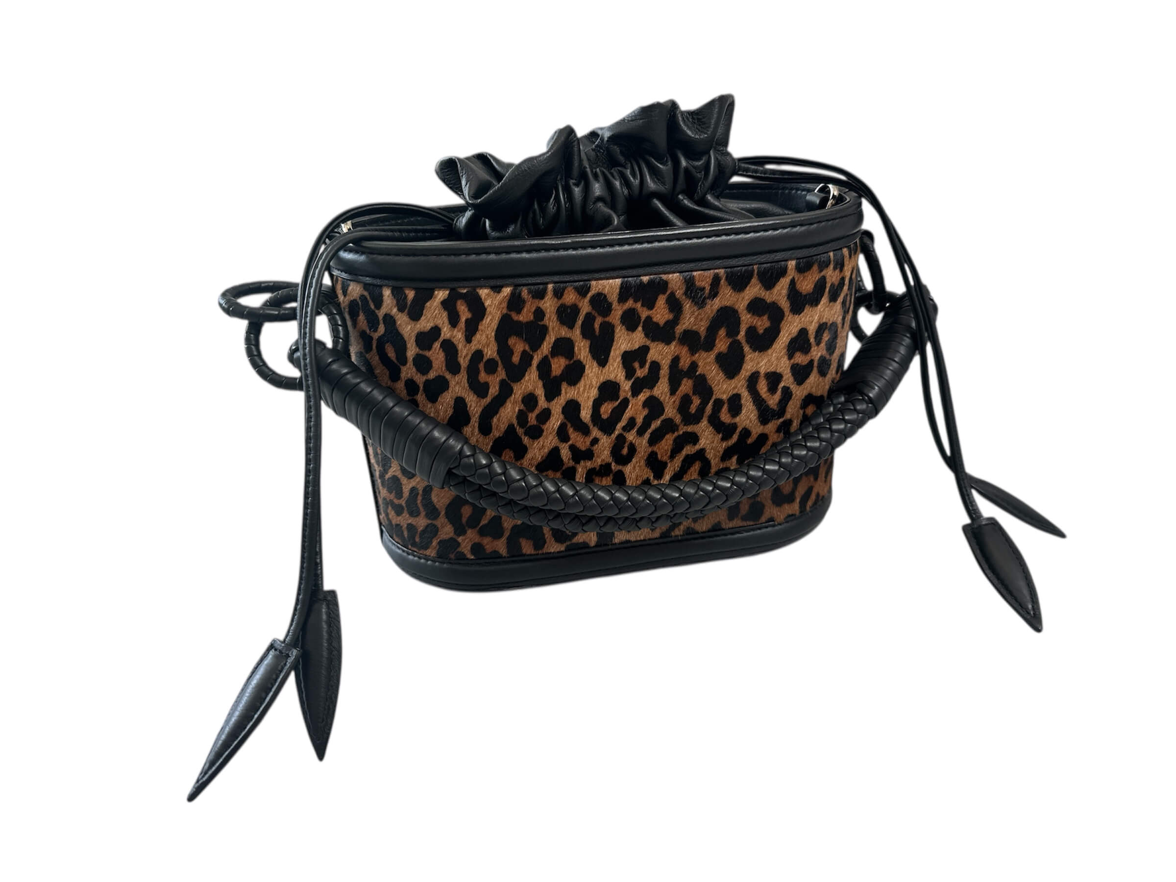Leopard print bag with black accents on a white background.