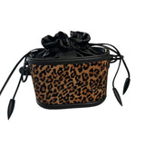 Leopard print drawstring bag with black accents on a white background.