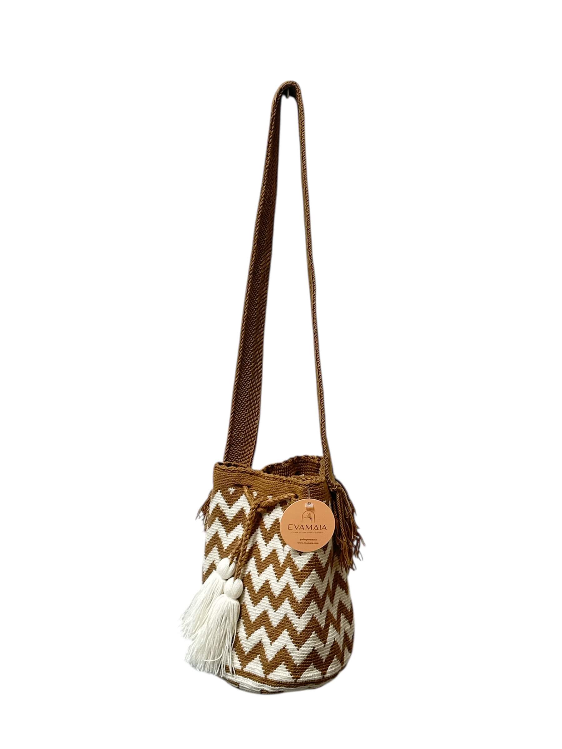 Brown and beige woven handbag with a visible brand tag on a white background.