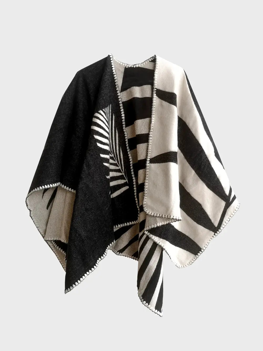 A black and white geometric inspired poncho.