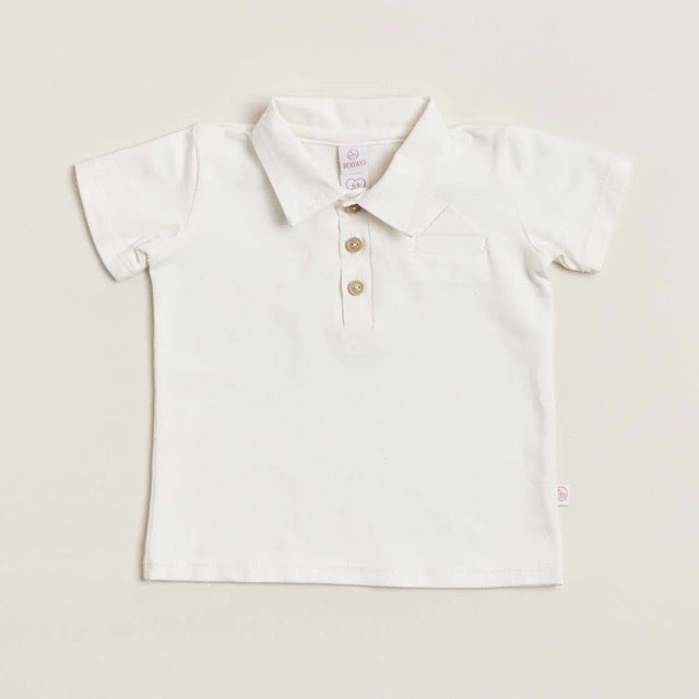 A white soft cotton polo shirt with a faux pocket, standing against a white background.