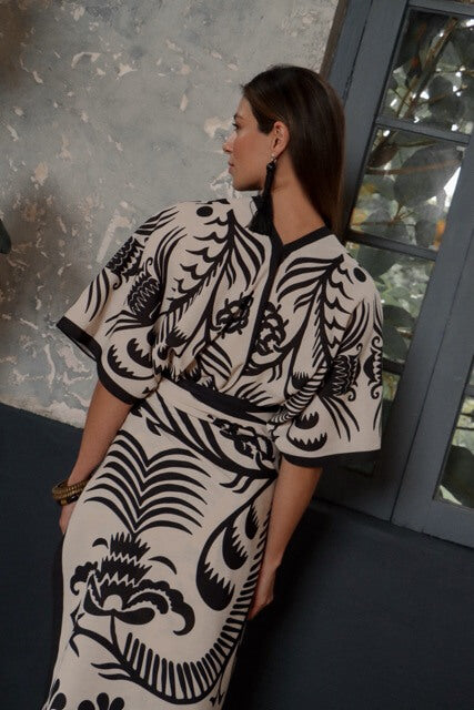 Woman wearing a white and black patterned kimono.