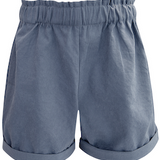 Girls blue shorts with ruffled waistband on a white background.