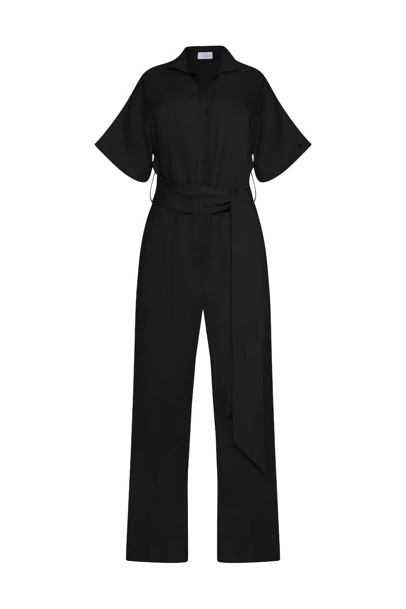 Women wearing a black jumpsuit with matching belt and a V-neck collar.