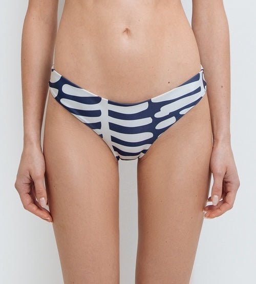 Close up of a model wearing a navy and white nautical stripe bikini bottom made from high-quality nylon and spandex.