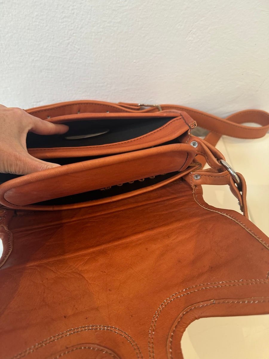 Close-up look of the inside of our Western Style leather crossbody bags. This one is Camel. It shows the pockets and details of this bag.