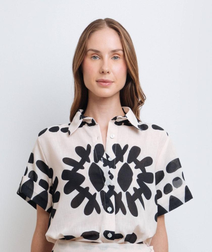 Model wearing a stylish black and white abstract print shirt made from high-quality polyester with a linen-like feel
