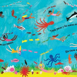 A page from the children's book 'El Mundo' featuring a colorful illustration of children in a vibrant ocean swimming alongside many different kinds of sea life.