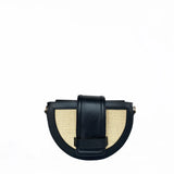Black and beige handbag on a white background.