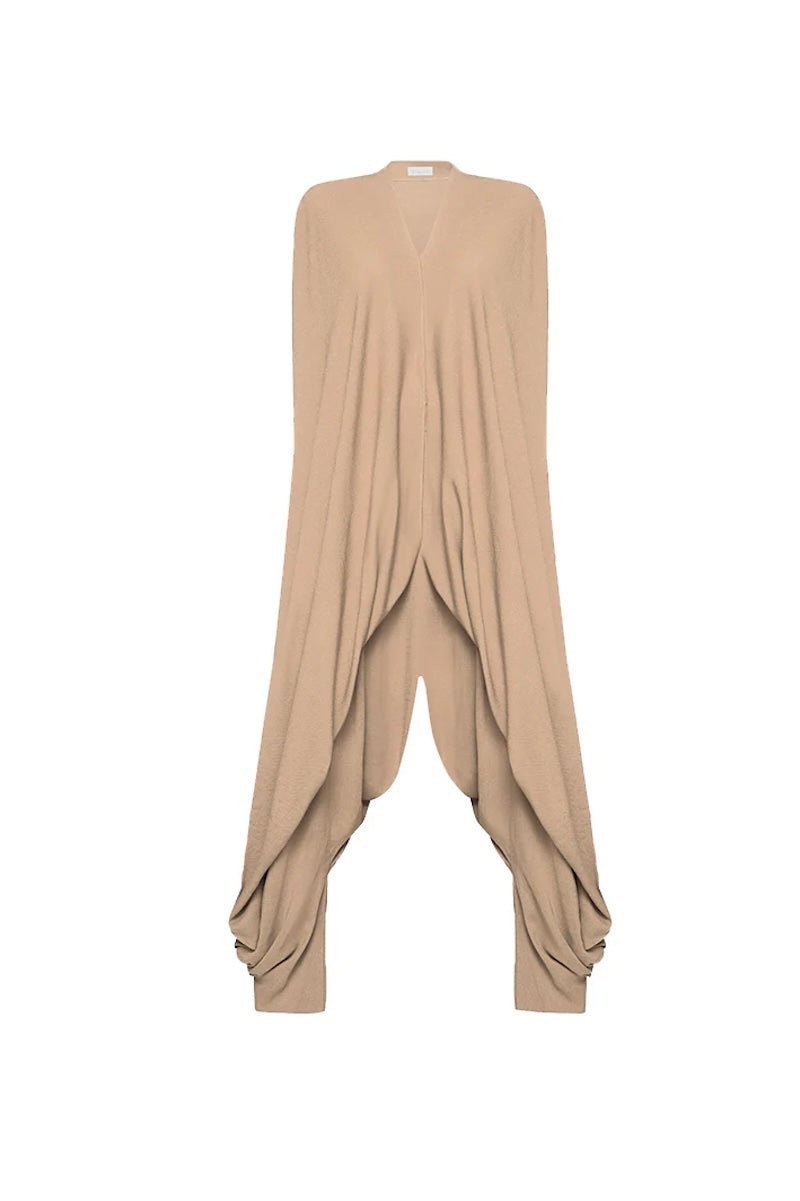 Image of a jumpsuit against a white background. The purpose of this image is to highlight the jumpsuit from NAOS, which is for sale at EVAMAIA boutique in Studio City, CA.